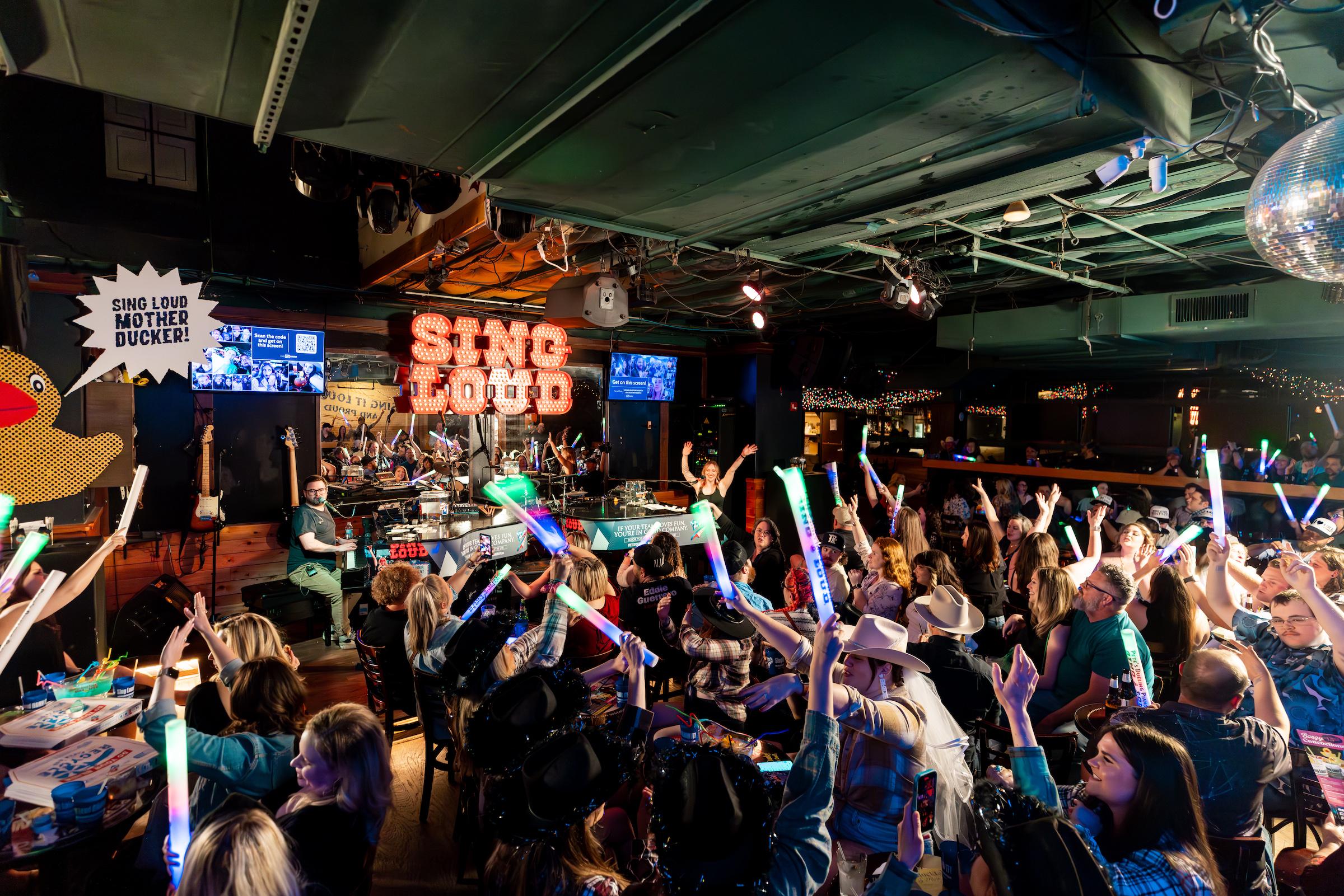 Live music performance at a vibrant bar in Frisco TX with crowd enjoying nightlife